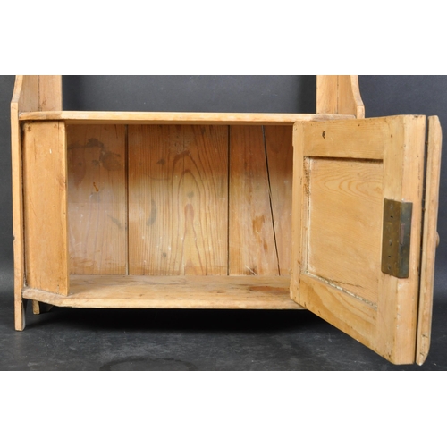 1426 - A Victorian 19th century pine hanging cabinet. Shelf over single twin door cupboard with shaped upri... 