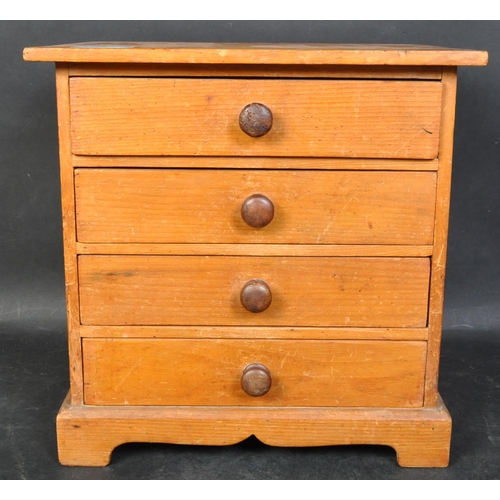 1428 - A Victorian 19th century country pine apprentice piece chest of drawers. Bracket feet with bank of 4... 