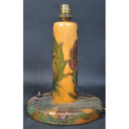 1430 - An early 20th century satin wood coloured wooden drip glaze painted table lamp in the manner of Moor... 