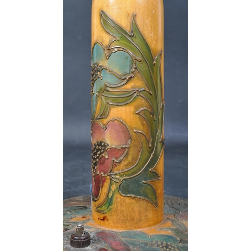 1430 - An early 20th century satin wood coloured wooden drip glaze painted table lamp in the manner of Moor... 