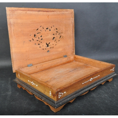 1437 - A vintage 20th century ebonised wooden desk top box with mother pearl inlaid. The case having a intr... 