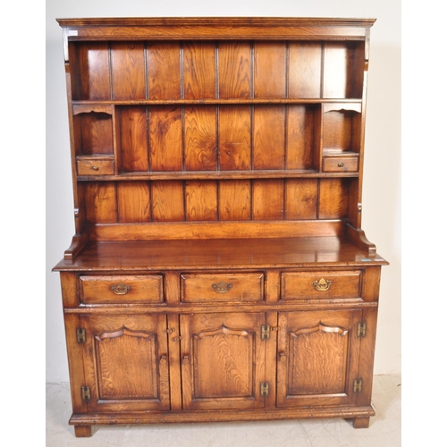 1439 - Ipswich oak George III 18th century revival dresser. Raised on plinth base with short drawers over c... 