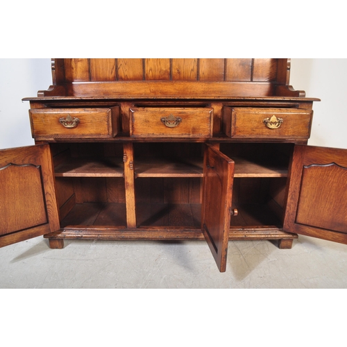 1439 - Ipswich oak George III 18th century revival dresser. Raised on plinth base with short drawers over c... 