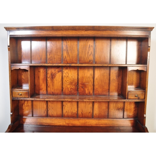 1439 - Ipswich oak George III 18th century revival dresser. Raised on plinth base with short drawers over c... 