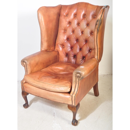 1440 - Queen Anne revival large oversized tan leather Chesterfield armchair. Raised on claw and ball feet w... 