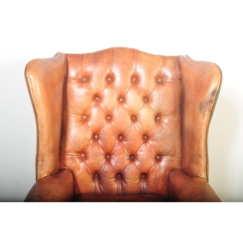 1440 - Queen Anne revival large oversized tan leather Chesterfield armchair. Raised on claw and ball feet w... 