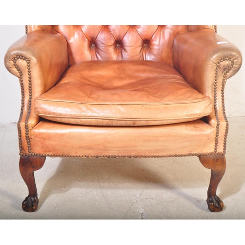 1440 - Queen Anne revival large oversized tan leather Chesterfield armchair. Raised on claw and ball feet w... 