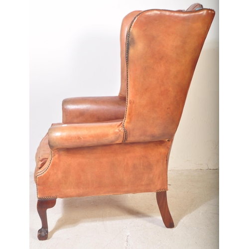 1440 - Queen Anne revival large oversized tan leather Chesterfield armchair. Raised on claw and ball feet w... 