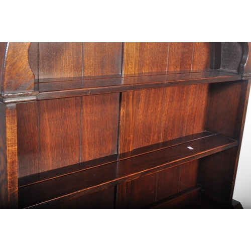 1445 - A Wood Bros Old Charm type Jacobean revival oak dresser. Raised on a plinth base with twin ' linen f... 