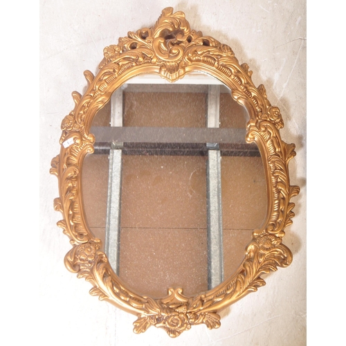 1447 - A pair of contemporary 20th century rococo style gilt plaster mirrors. Together with a convex / fish... 