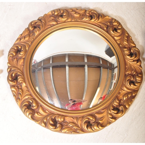 1447 - A pair of contemporary 20th century rococo style gilt plaster mirrors. Together with a convex / fish... 