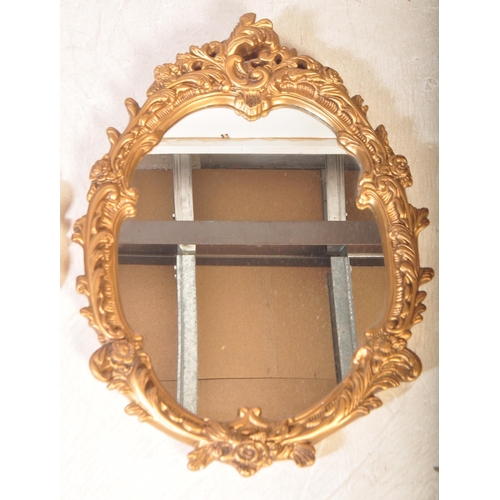 1447 - A pair of contemporary 20th century rococo style gilt plaster mirrors. Together with a convex / fish... 