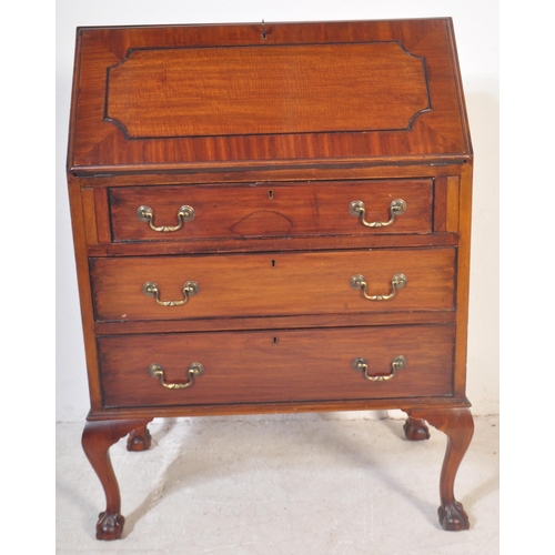 1452 - A 20th century Queen Anne revival mahogany bureau desk being raised on cabriole legs with claw & bal... 