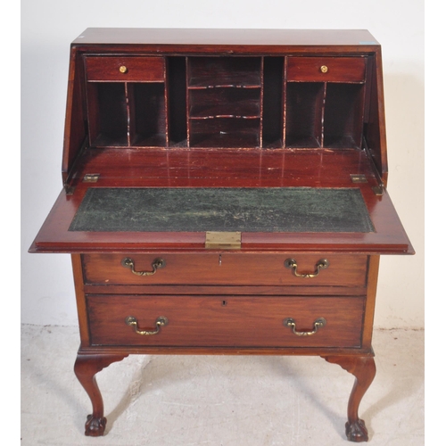 1452 - A 20th century Queen Anne revival mahogany bureau desk being raised on cabriole legs with claw & bal... 