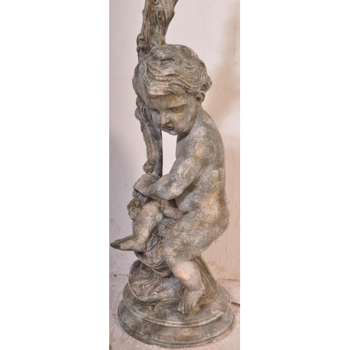 1453 - A 20th century large composite cherub Rococo table lamp with shade. Measures approx. 95cm x 25cm dia... 