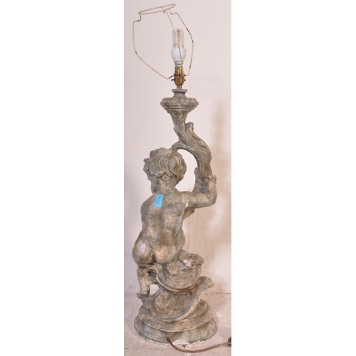 1453 - A 20th century large composite cherub Rococo table lamp with shade. Measures approx. 95cm x 25cm dia... 