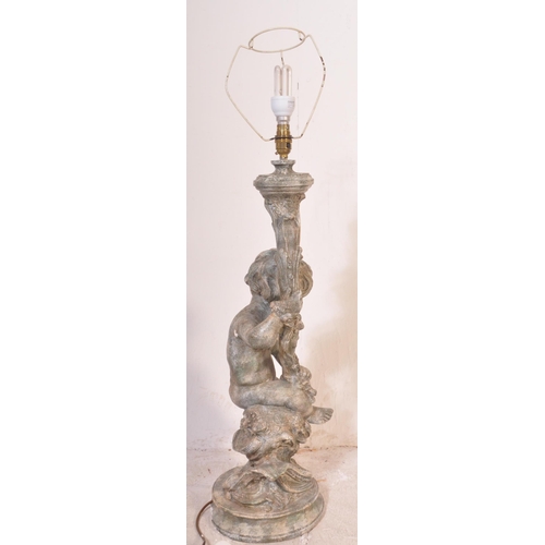 1453 - A 20th century large composite cherub Rococo table lamp with shade. Measures approx. 95cm x 25cm dia... 