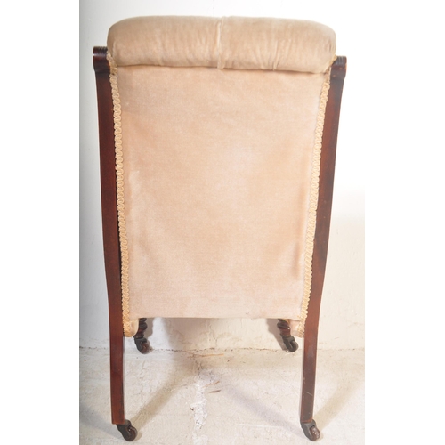 1454 - A Victorian 19th century Aesthetic movement nursing chair being raised on turned legs with castors h... 