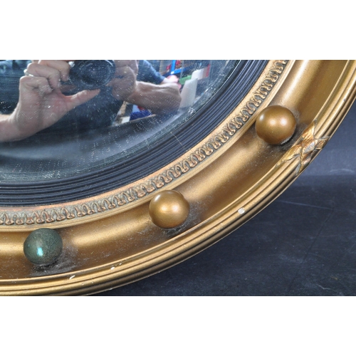 1456 - A vintage 20th century Regency Revival Atsonia convex wall mirror having gilt frame with studded bal... 