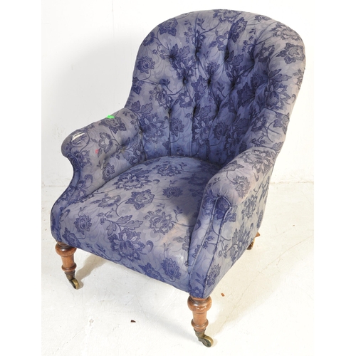 1458 - A Victorian late 19th century upholstered armchair. The chair having a spoon buttoned back over elbo... 