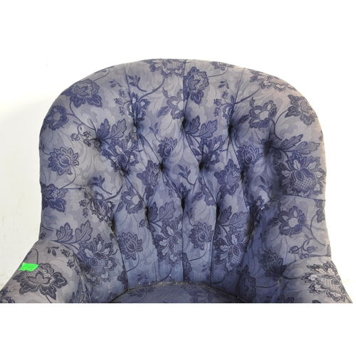 1458 - A Victorian late 19th century upholstered armchair. The chair having a spoon buttoned back over elbo... 