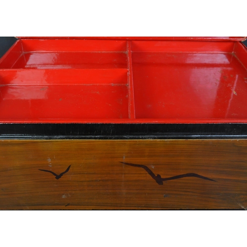 1460 - A 19th century large Chinese / Japanese chinoiserie  large lacquered box with decorative red and gil... 