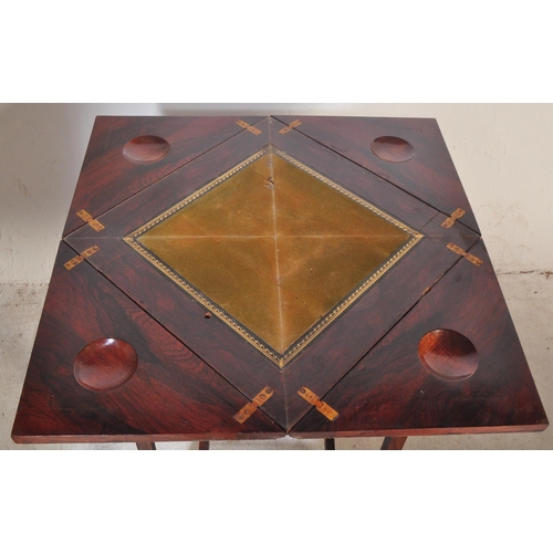 1462 - Manner of Edwards & Roberts. An Edwardian rosewood inlaid envelope card table. Of square form with f... 