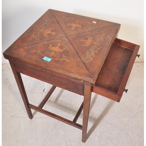 1462 - Manner of Edwards & Roberts. An Edwardian rosewood inlaid envelope card table. Of square form with f... 