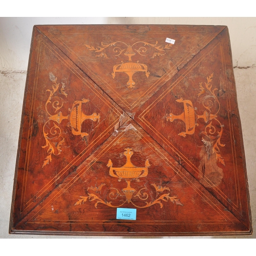 1462 - Manner of Edwards & Roberts. An Edwardian rosewood inlaid envelope card table. Of square form with f... 