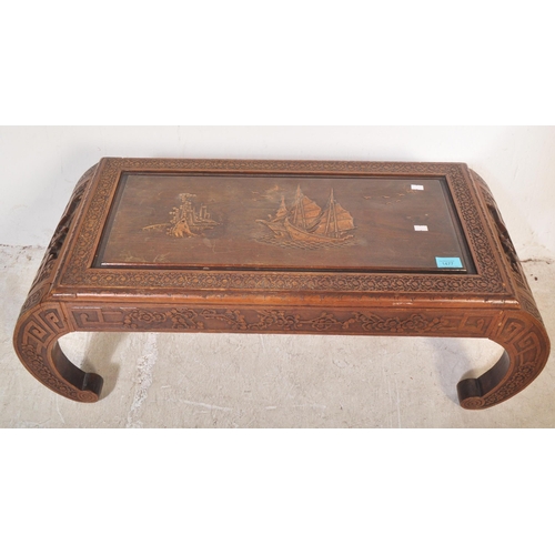 1477 - An early 20th century circa. 1930's Chinese carved hardwood opium coffee table having carved scenes ... 