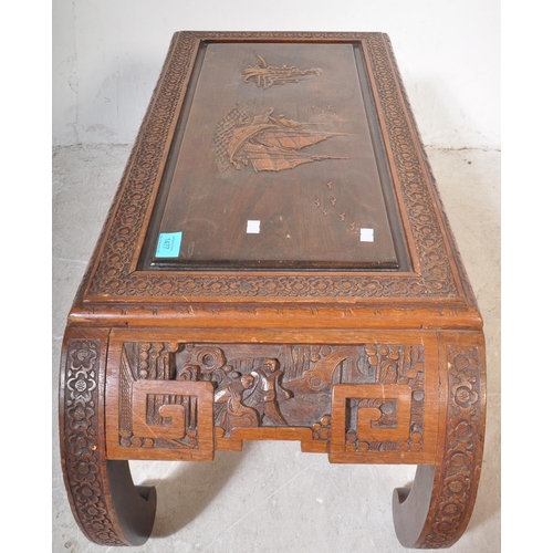 1477 - An early 20th century circa. 1930's Chinese carved hardwood opium coffee table having carved scenes ... 