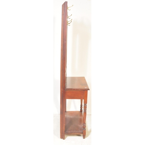 1481 - A Victorian 19th century mahogany hallstand having an arched top pediment over a central mirror on t... 