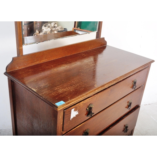 1486 - A vintage retro 20th century circa. 1950's oak veneer dressing chest of drawers. The chest having se... 