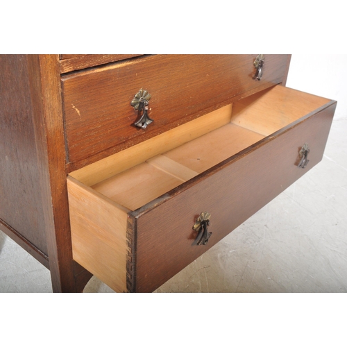 1486 - A vintage retro 20th century circa. 1950's oak veneer dressing chest of drawers. The chest having se... 