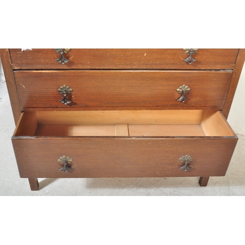 1486 - A vintage retro 20th century circa. 1950's oak veneer dressing chest of drawers. The chest having se... 