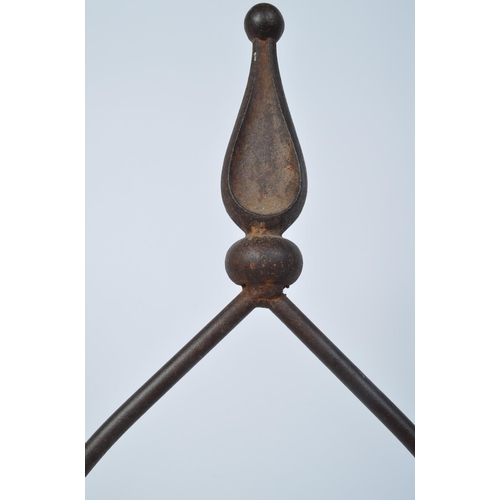 1488 - A Victorian 19th century cast metal ecclesiastic swinging candlestick holder having an intricate sha... 