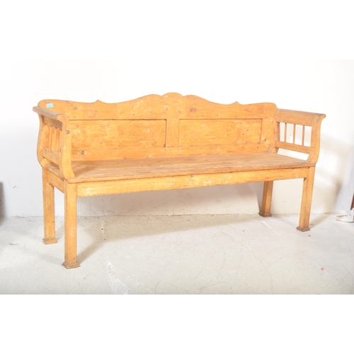 1494 - A 20th century large Scandinavian pine hall bench settle. The bench with hinged box seat compartment... 