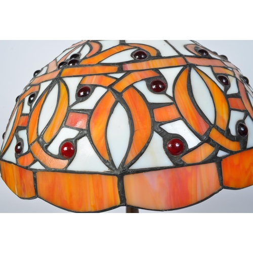 1505 - A large vintage 20th century Tiffany manner lamp in the Art Nouveau style. The lamp having domed sha... 