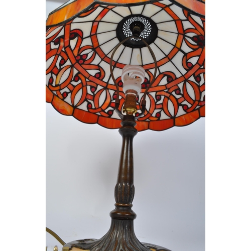 1505 - A large vintage 20th century Tiffany manner lamp in the Art Nouveau style. The lamp having domed sha... 