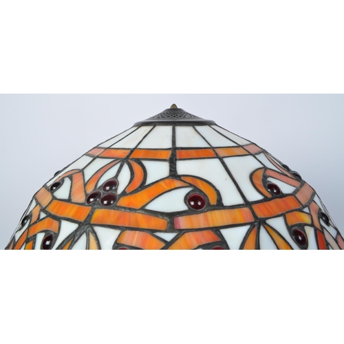 1505 - A large vintage 20th century Tiffany manner lamp in the Art Nouveau style. The lamp having domed sha... 