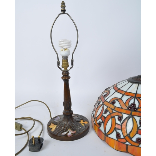 1505 - A large vintage 20th century Tiffany manner lamp in the Art Nouveau style. The lamp having domed sha... 