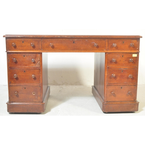 1508 - A Victorian 19th century mahogany and leather twin pedestal office desk. The desk being raised on pl... 