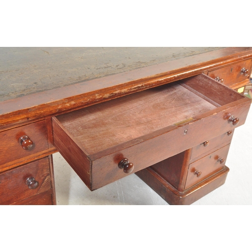 1508 - A Victorian 19th century mahogany and leather twin pedestal office desk. The desk being raised on pl... 