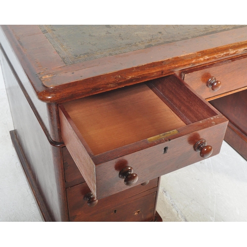 1508 - A Victorian 19th century mahogany and leather twin pedestal office desk. The desk being raised on pl... 