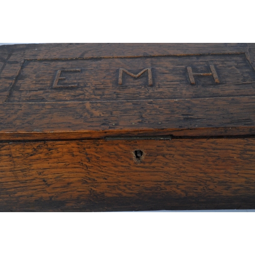 1509 - A 19th century Victorian oak casket box with carved into relief monogram EMH to the lid. Together wi... 