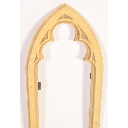 1511 - A 20th century composite stone Gothic style window frame of arched form with trefoil type inner fram... 