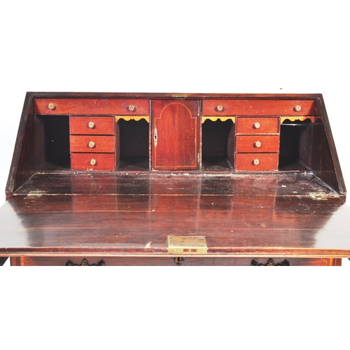 1512 - A 19th century mahogany inlaid bureau. The Bureau having fall front top with central canted string i... 