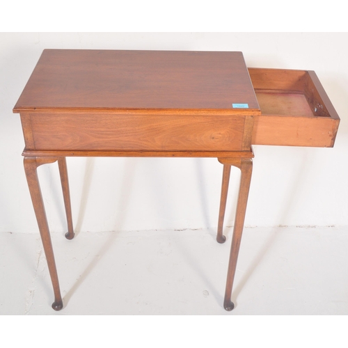 1520 - A 1940's Queen Anne revival mahogany writing table. Raised on cabriole legs with pad feet having fit... 