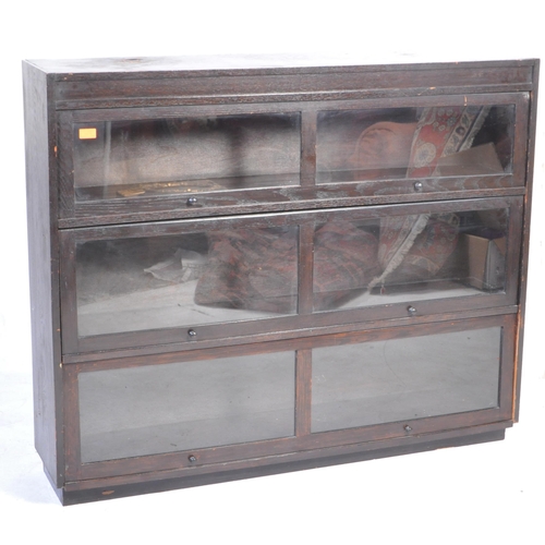 1533 - A large 20th century ebonised Globe Wernicke style barristers bookcase having a double bank of three... 