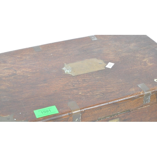 1537 - A 19th Century mahogany and brass table top writing slope / box. Of rectangular form with a personal... 